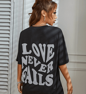 Trendy Oversized Women's Black T-Shirt with Statement Print